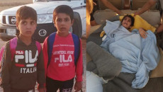 Three Turkmen children freed from IS captivity arrive home